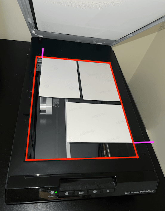 Shows proper placement of multiple images on the Epson V600 photo scanner.